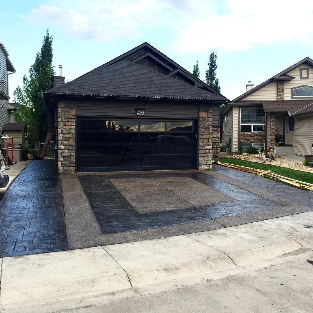 Stamped concrete driveway mimicking natural stone