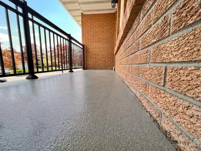 Penetrating sealer being applied to driveway